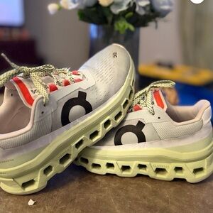 On Running Women’s Cloudstratus Sneakers in White with Pale Green Soles